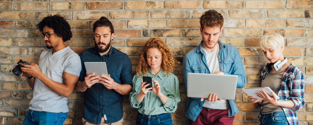 image of young people using technology